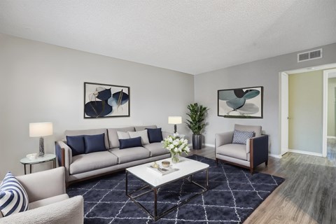 our apartments offer a living room with couches and a coffee table